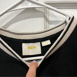 Black shirt with white collar